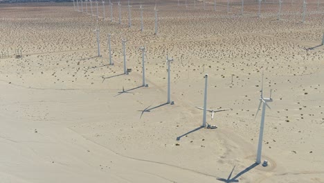 Aerial-orbiting-shot-of-wind-farm-in-Palm-Springs-desert-|-Afternoon-lighting