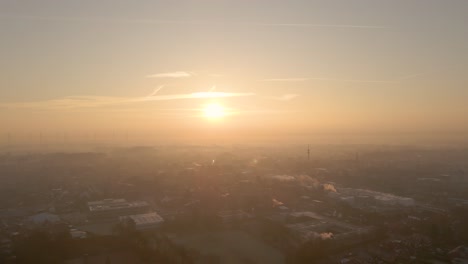 Glowing-Golden-Sunrise-With-Morning-Mist-Over-Industrial-Landscape