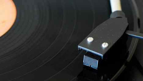 rock music vinyl record disc spinning on a retro-style vinyl disc player