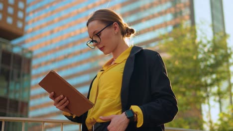 Woman-lawyer-standing-with-Digital-Tablet-PC-at