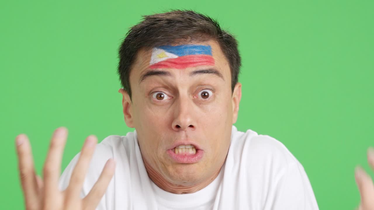 Man with philippine national flag upset with a referee