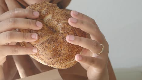 person eating a bagel