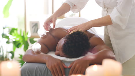 caucasian therapist using cupping treatment