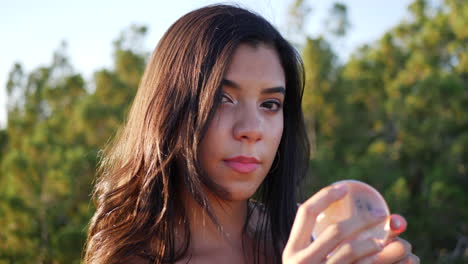 Close-up-on-the-eyes-of-a-beautiful-dreamy-woman-staring-with-a-magic-crystal-ball