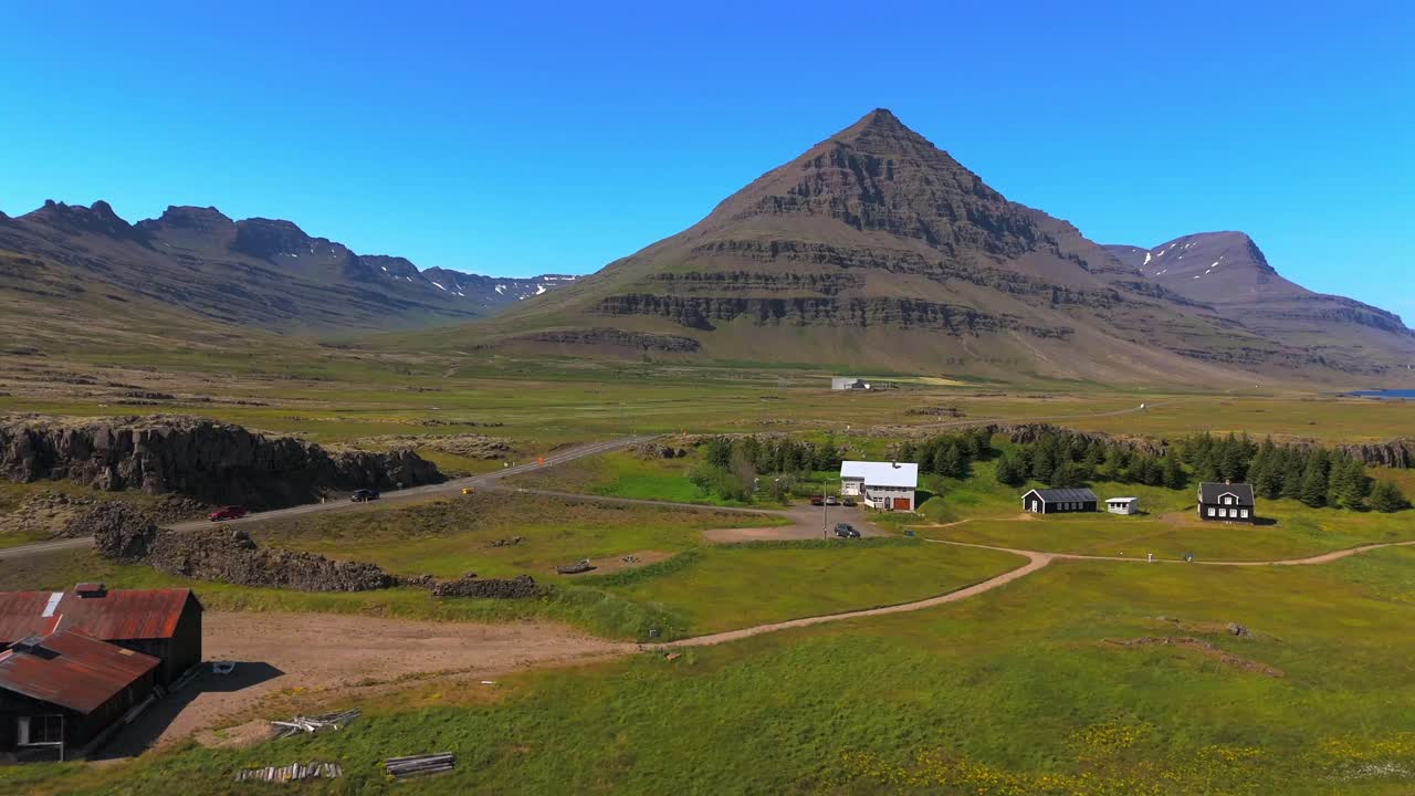 Immerse yourself in the beauty of Djúpivogur’s mountains, with the drone capturing their grandeur and the serene landscapes that surround them.
