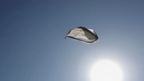 white cloth flying in the sky