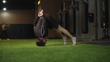energetic male boxer exercising in sport club. sport man warming up at gym