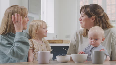 Same-Sex-Female-Couple-Having-Healthy-Breakfast-At-Home-With-Daughter-And-Baby-Son