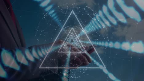 animation of lights and triangles moving over hands of caucasian businessman using smartphone