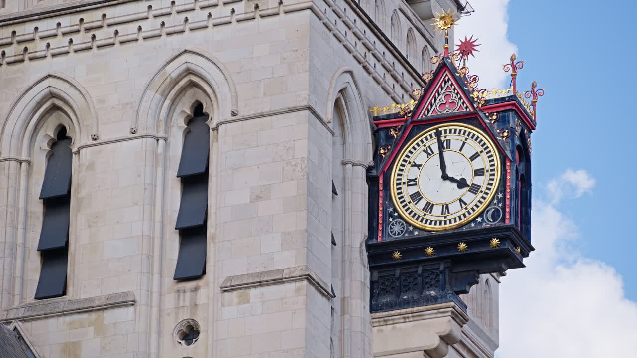 Street view of the clock tower and of the Royal Courts of Justice in London, England