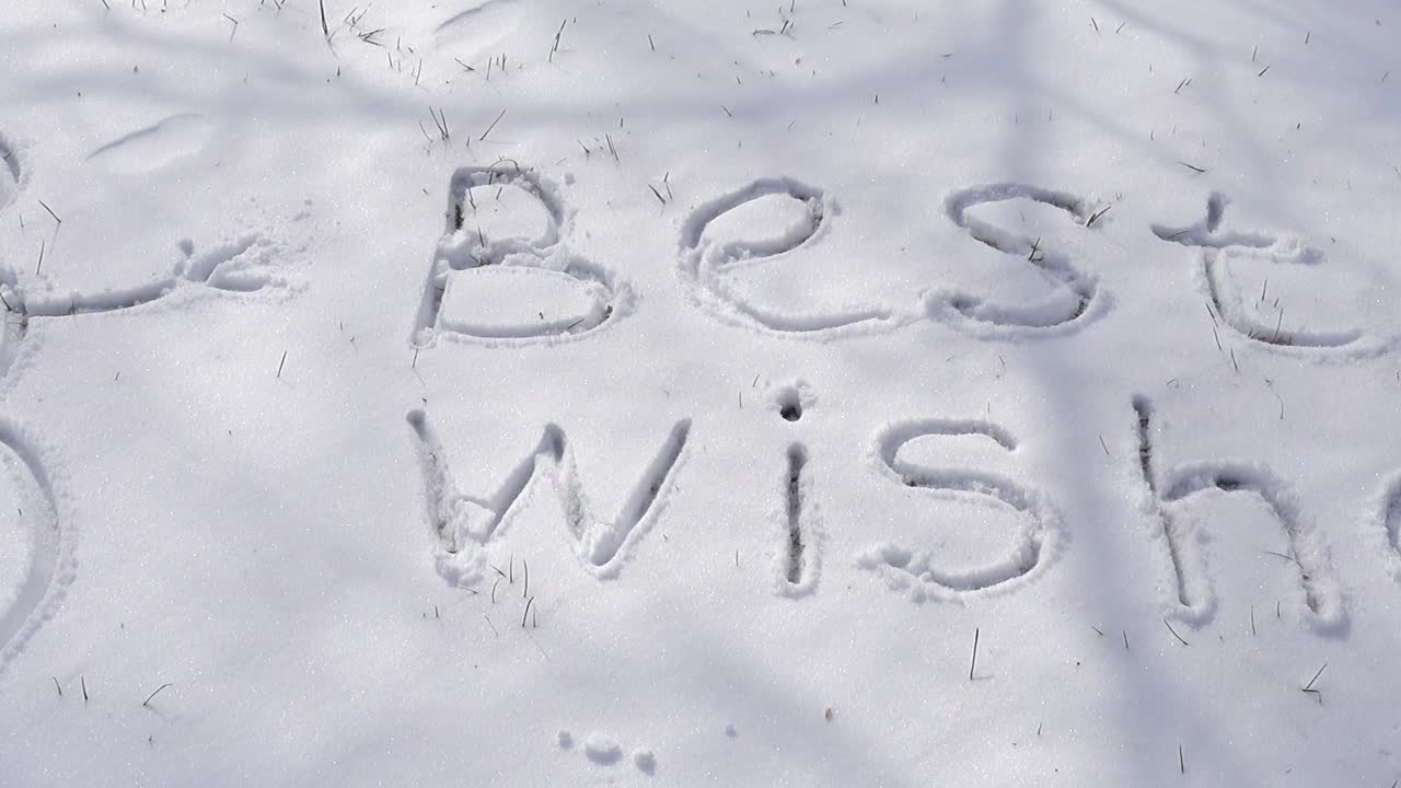 The inscription best wishes on snow. Shooting in the winter