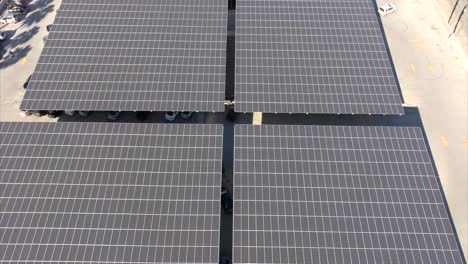 Northridge-shopping-mall-solar-panels-aerial-view-rising-over-photovoltaic-roofing-renewable-energy-system