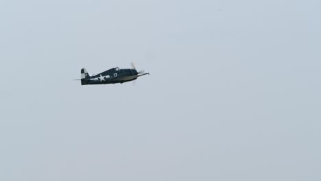 tracking shot of a f6f hellcat wwii naval warplane