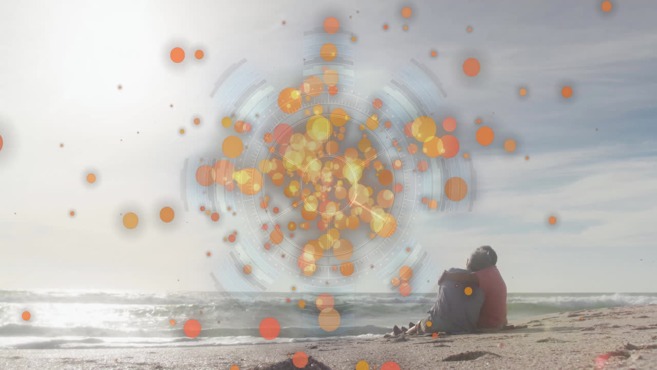 Person sitting on beach with colorful circular animation over ocean waves