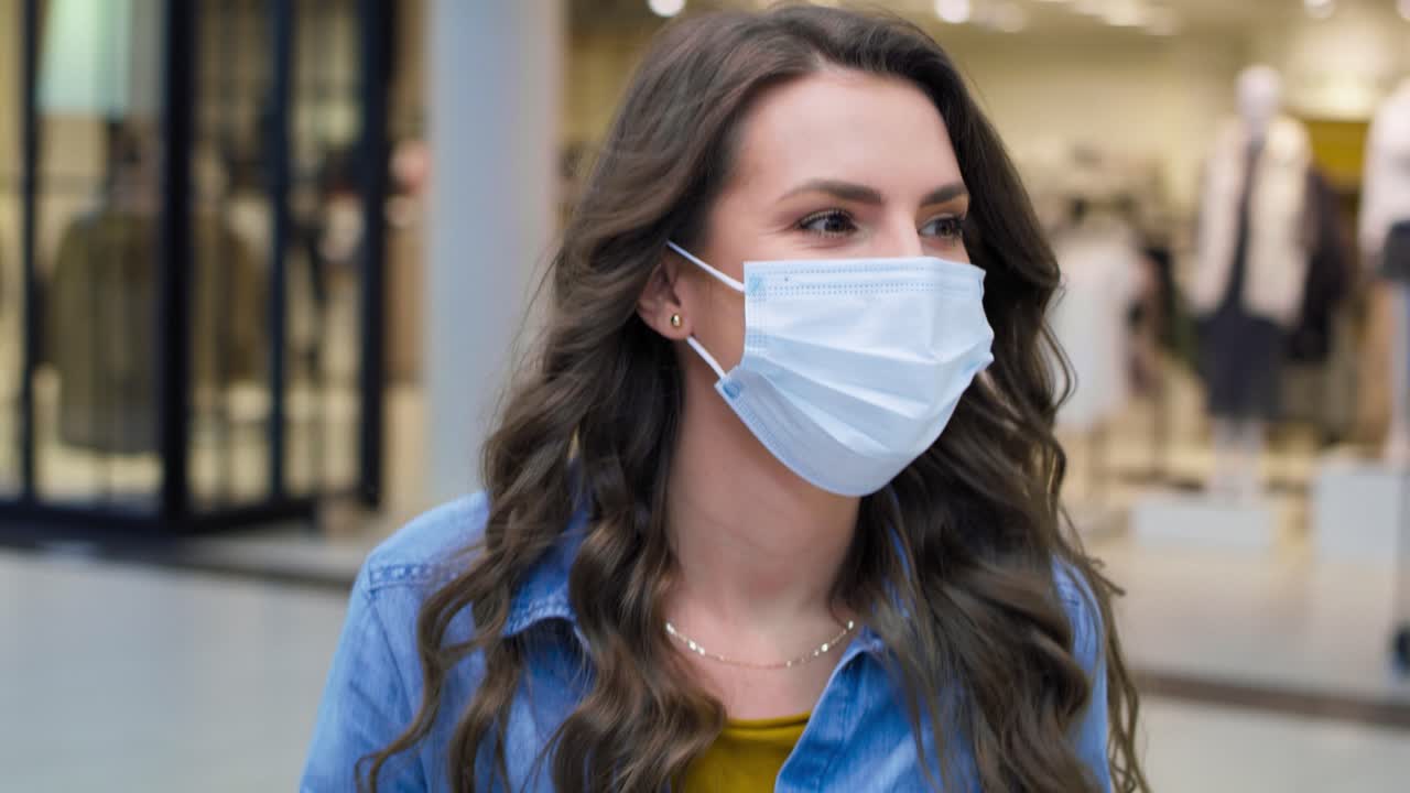 Video of happy woman in shopping mall during pandemic
