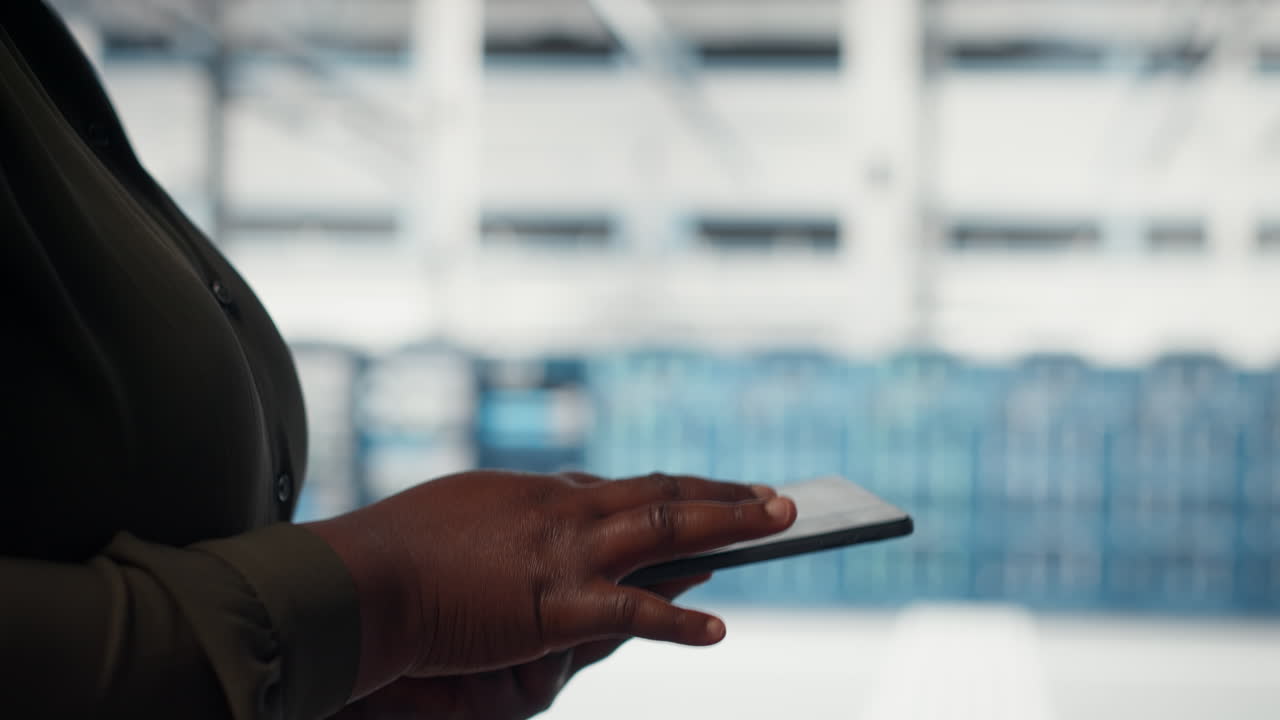 Close up of data center software developer doing data analysis on tablet