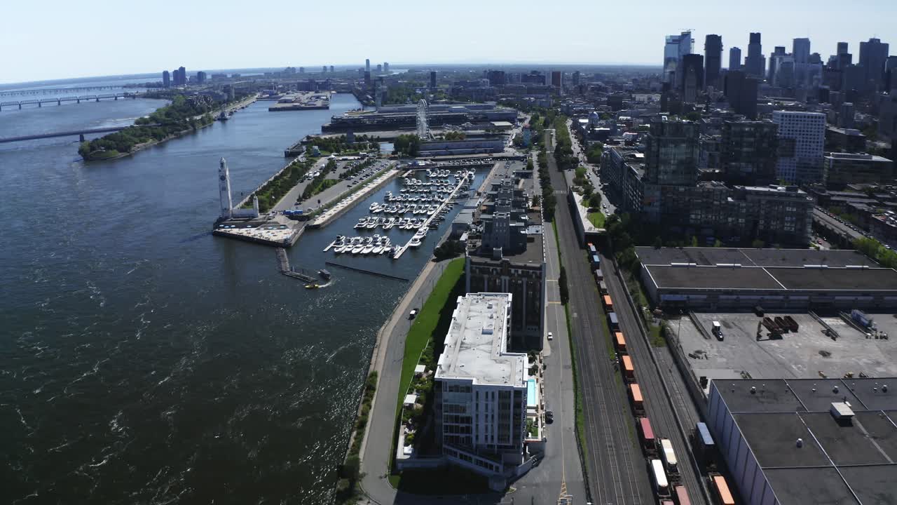 A serene shot of the lighthouse near Montreal's Old Port, standing tall against the river and cityscape. A symbol of guidance and tranquility, perfect for capturing the charm of the waterfront.