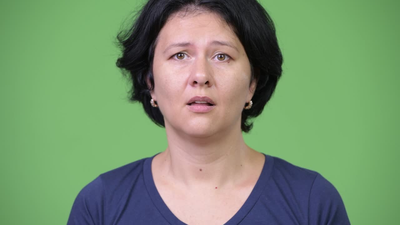 Beautiful woman with short hair looking shocked