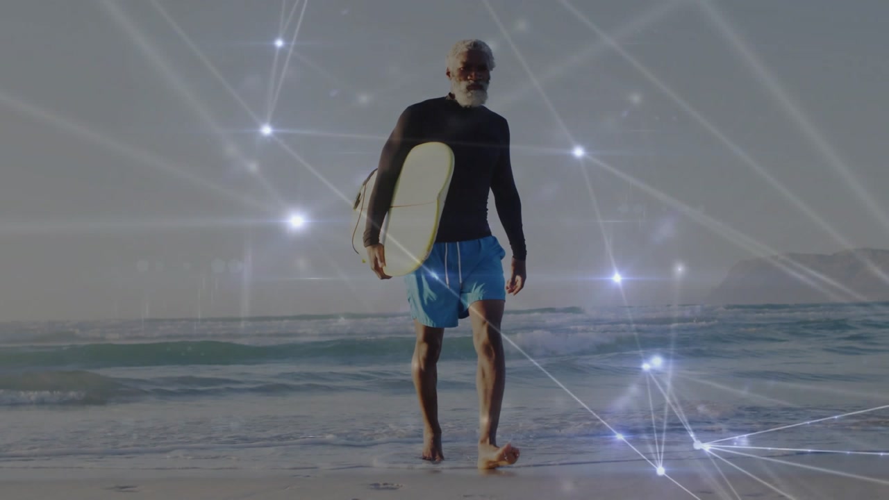 Mature surfer walking toward shore after session, carrying surfboard, tech nodes tracking steps