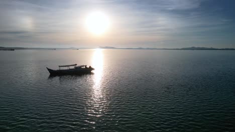 silhouette-of-Indonesian-fishing-boat-floating-on-calm