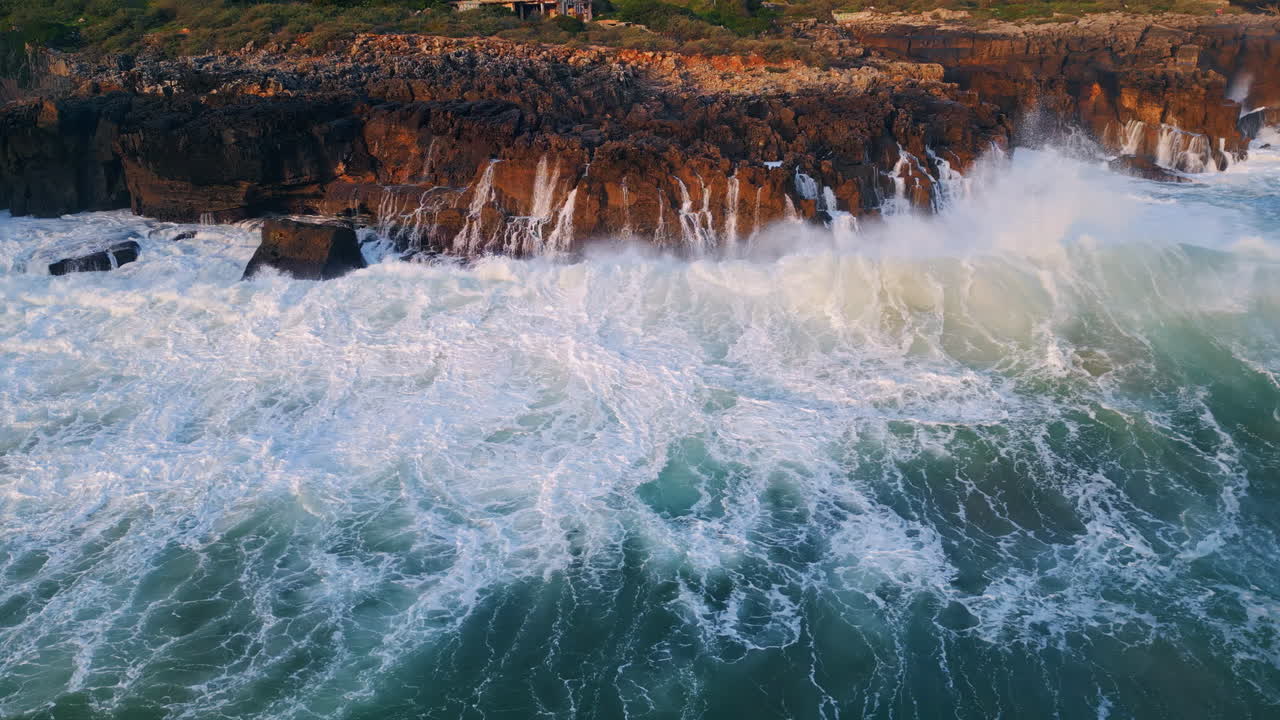 Powerful ocean surf crashing cliff aerial view. Marine swell splashing at coast