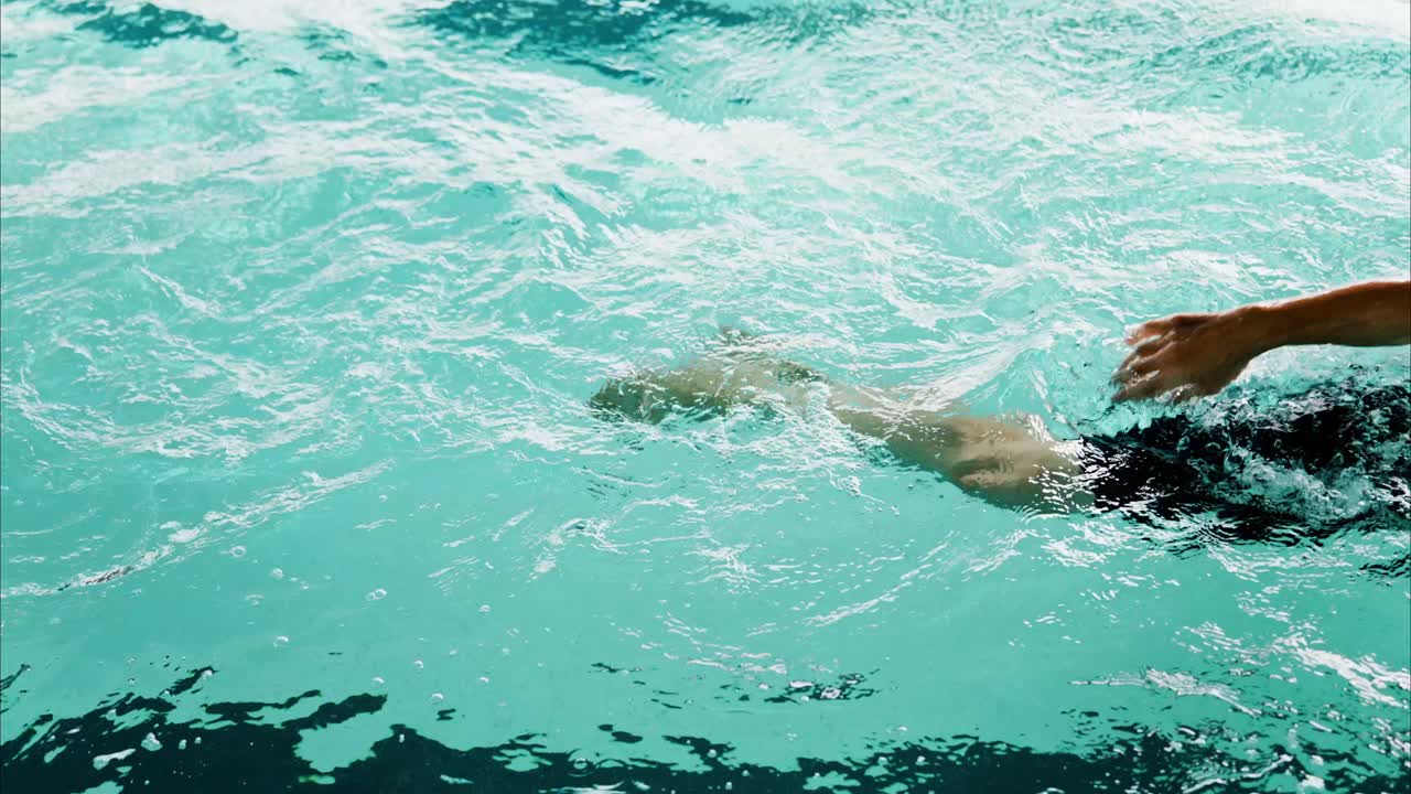 A serene exploration of water dynamics as ripples and bubbles create captivating patterns on the surface, showcasing the beauty of reflections and movement in a tranquil aquatic environment