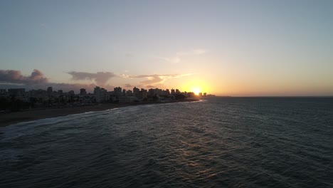 sun is setting over ocean beach in puerto rico