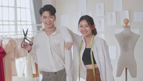 young asian couple of fashion designers