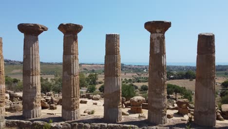 ancient roman columns standing tall, ruins from historic empire building, aerial