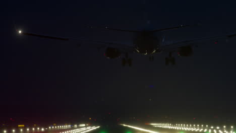 airplane landing at night in fog