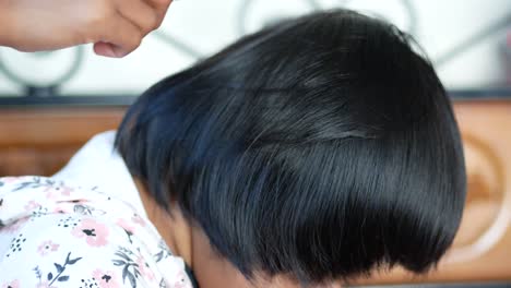 child combing hair