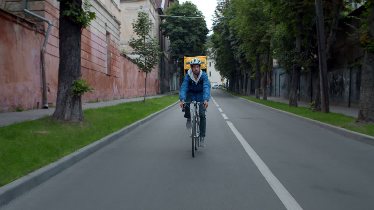 Delivery cyclist on a city road