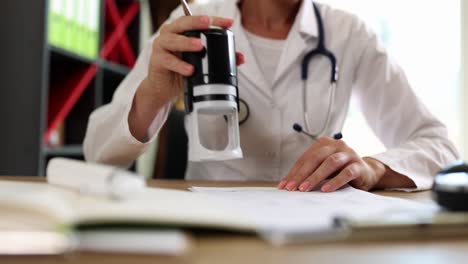 medical professional stamping a document