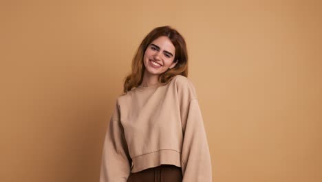 happy young woman smiling at camera standing