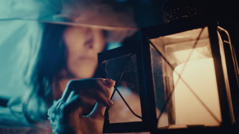 mysterious figure holding a lantern