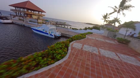Crazy-fpv-race-drone-flying-through-Hotel-Hilton-Garden-Inn-of-La-Romana-in-Dominican-Republic-and-toward-beacon
