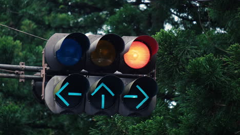 The traffic light turns from green to red at the financial district intersection