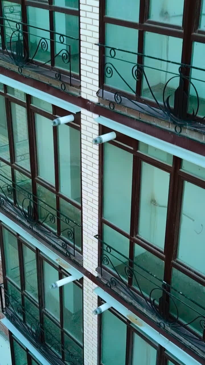 Buildings construction in process. High buildings under construction in new district Vertical video