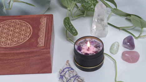 amethyst candle burning next to a spirit box