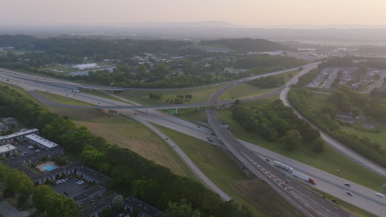Aerial drone footage slowly moving towards the Highway 153 and Interstate 75 Interchange in Chattanooga, TN during the golden hour sunset