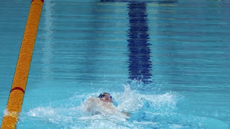 swimmer practicing in a clear blue pool