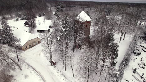 old stone church in latvian country side, winter time