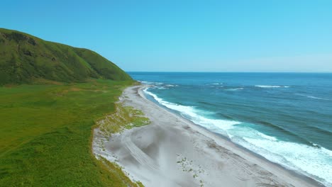 coastal landscape with lush greenery and gentle waves