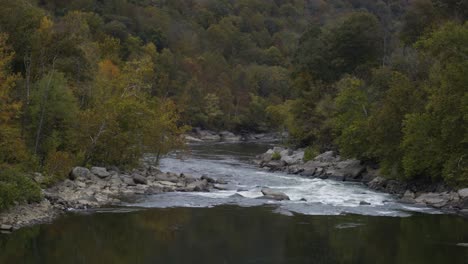 Static-shot-of-white-water-flowing-down-through-the-River-Gorge,-West-Virginia