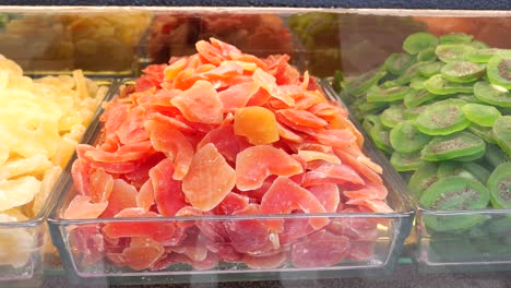 assortment of colorful dried candied fruits in a display