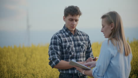 Farmer-And-Agronomist-Discussing-In-Field