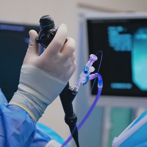 surgeon's hand operating endoscope in a medical procedure