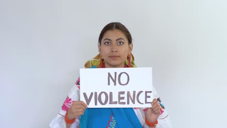 cinematic clip of a young brunette latin girl wearing the traditional outfit named cayambeñas showing up a message saying "no violence