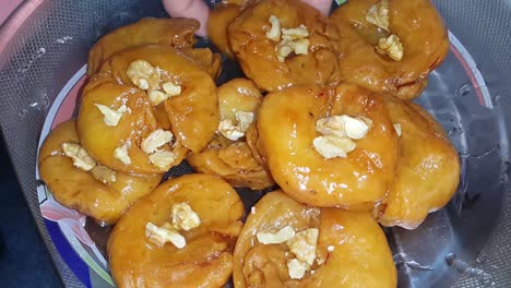 closeup of cooking south asian sweet dish called balu shahi or baloshahi.