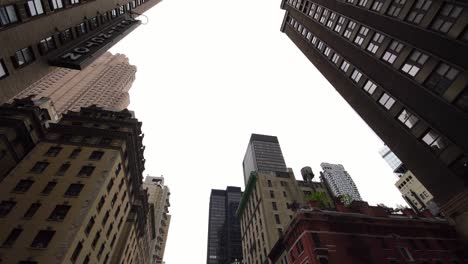 low angle moving shot of classical skyscrapers buildings in downtown nyc new york city manhattan